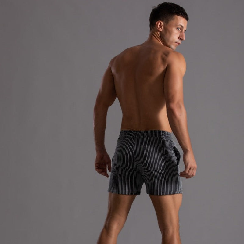 Fashionable men's quick-dry swim trunks. Ripstop fabric, perfect for beach, pool, and summer adventures.