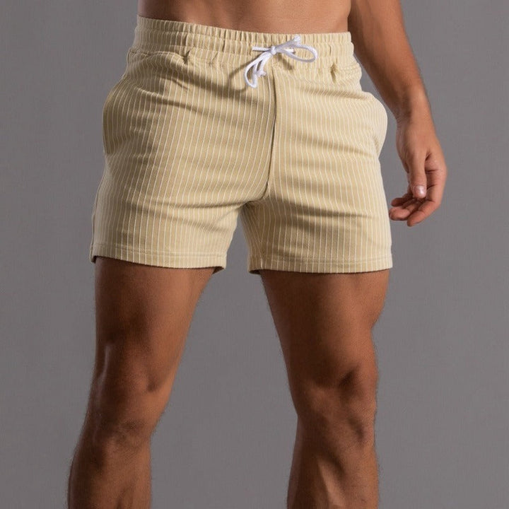 Quick-dry men's swim trunks. Sporty, slim fit beachwear for summer and vacation essentials.