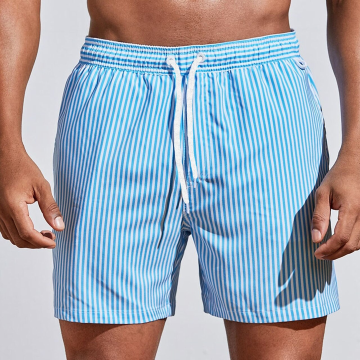 Classic striped men's swim trunks, featuring an elastic waist & drawstring for comfortable pool and beach days.