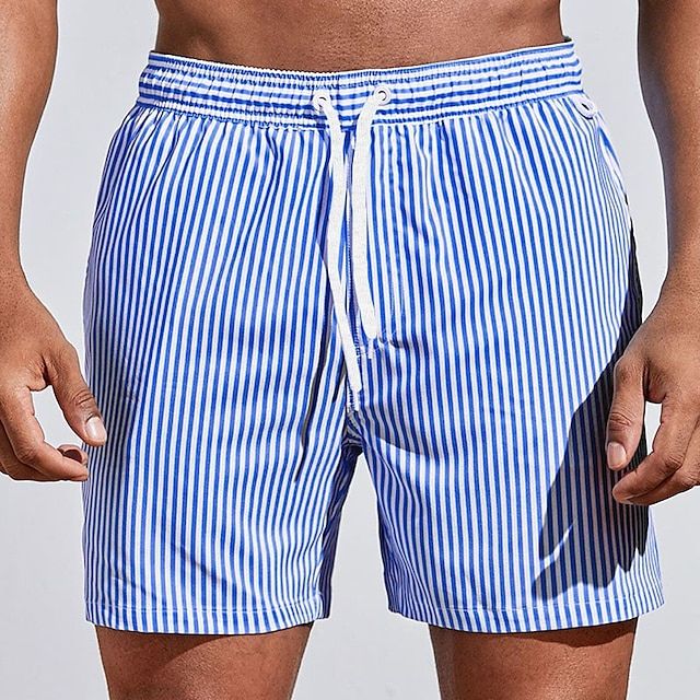 Men's quick dry swim shorts for comfortable beachwear. Versatile summer fashion, perfect for pool or ocean.