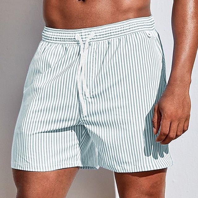 Comfortable men's quick dry drawstring swim shorts. Ideal activewear for poolside fun and beach activities.