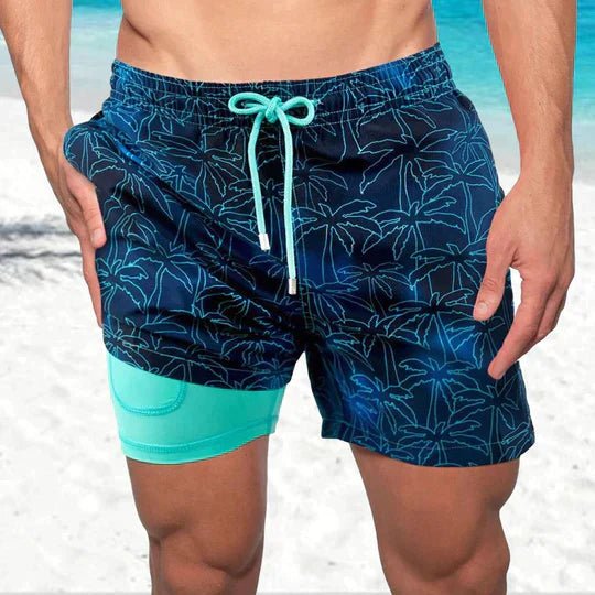 Men's tropical print quick-dry swim shorts with built-in compression for summer beachwear.