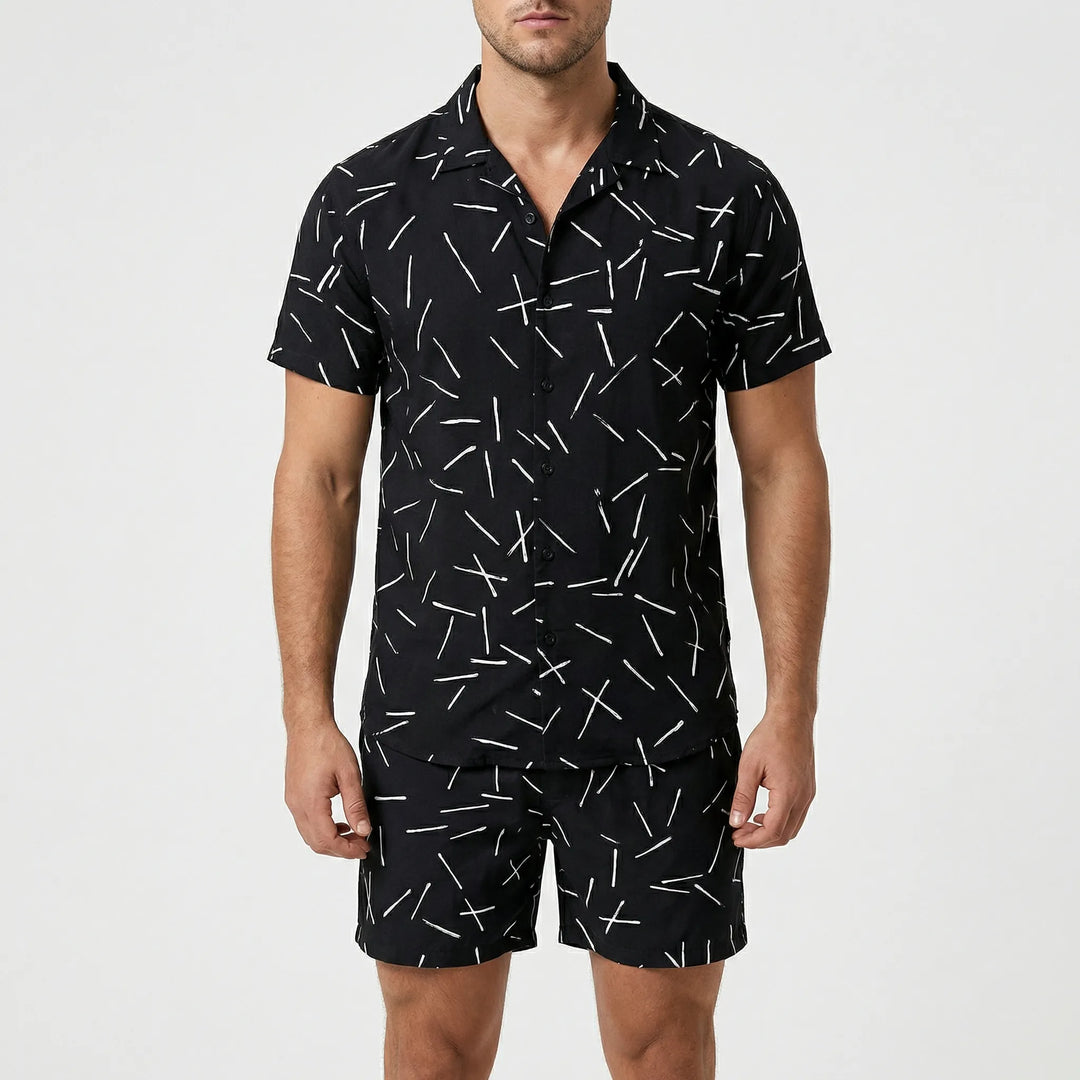 Model showcasing men's bold print two-piece summer set, comfortable & stylish fashion.