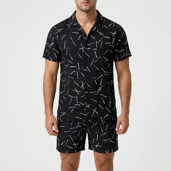 Model showcasing men's bold print two-piece summer set, comfortable & stylish fashion.