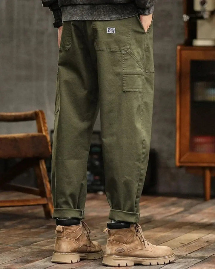 Relaxed fit men's cargo pants with multiple spacious pockets, perfect for outdoor & utility needs.