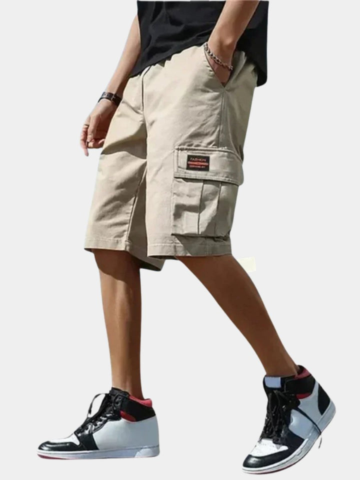 Men's relaxed fit cargo shorts in tan, perfect for everyday casual wear and summer comfort. Utility pockets.