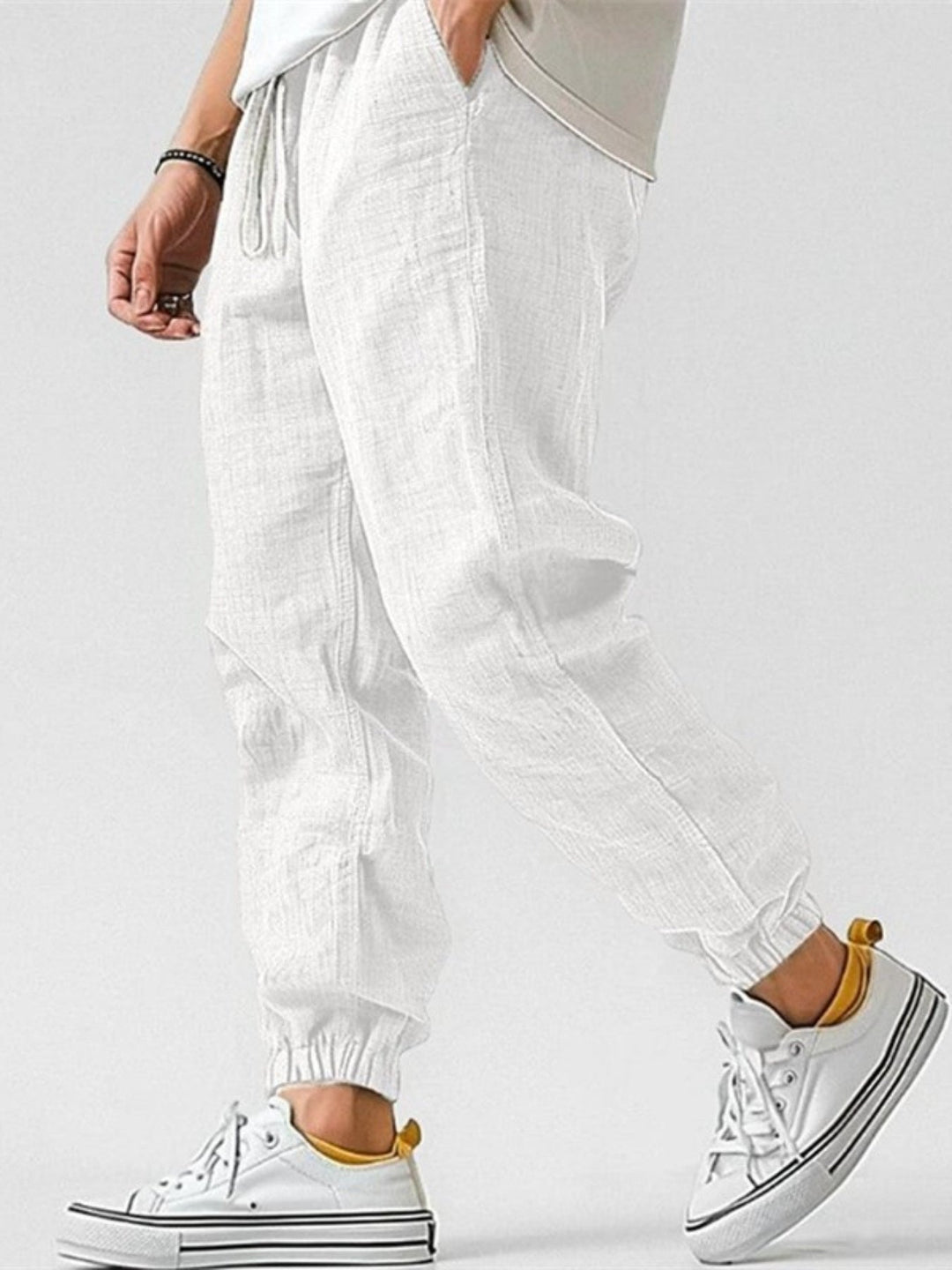 Stylish men's cuffed joggers with drawstring waist & tapered fit. Ideal for comfortable casual & travel wear.