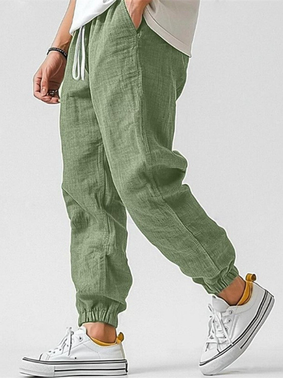 Modern men's cuffed track pants, offering a relaxed fit and everyday comfort for casual fashion.