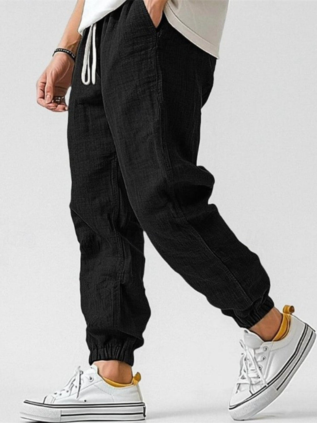 Comfortable men's joggers with a relaxed fit and cuffed ankles, great for summer casual & travel.