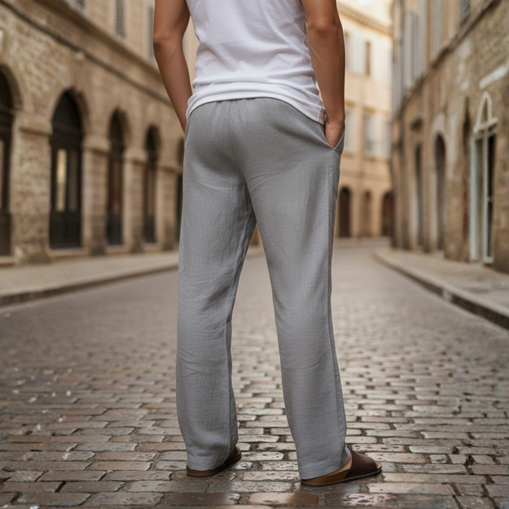 Breathable men's relaxed fit linen trousers with adjustable drawstring waist for casual summer wear.