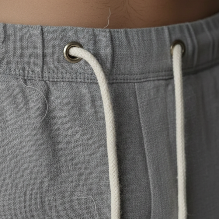Baggy fit men's linen pants with comfortable drawstring, ideal for relaxed summer fashion & events.