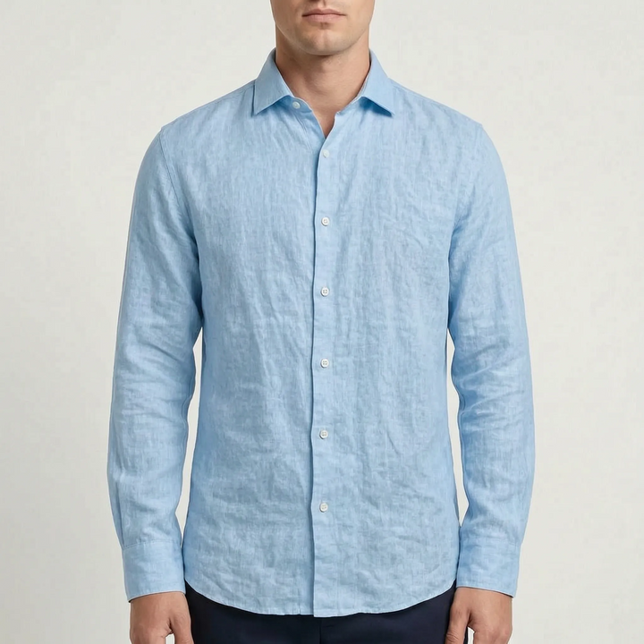 Close-up of a men's long-sleeve button-up shirt, showcasing the buttons and relaxed collar design.