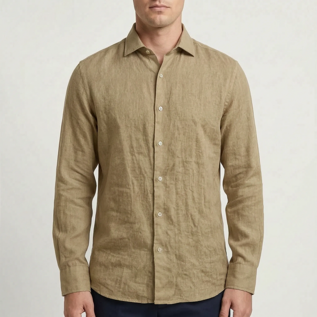 Man wearing a relaxed fit solid long-sleeve button-up shirt, styled casually for warm weather.