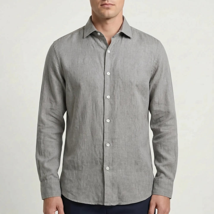 Back view of a men's relaxed long-sleeve button-up shirt, showcasing its comfortable drape and fit.