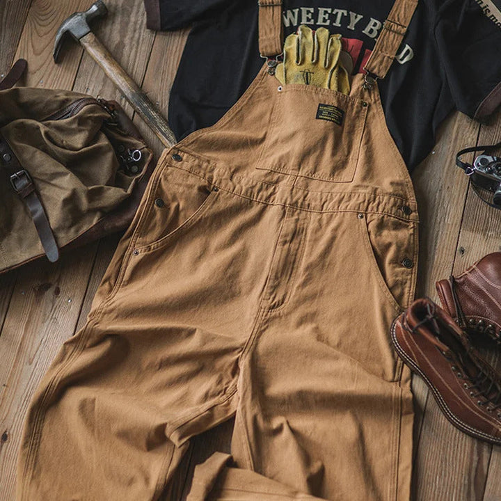 Versatile men's relaxed fit bib overalls, blending casual everyday wear with a trendy workwear look.