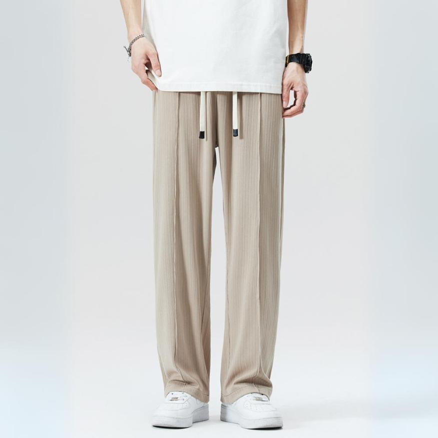 Men's relaxed fit pleated trousers, perfect for comfortable smart casual style. Elastic waist for easy wear.
