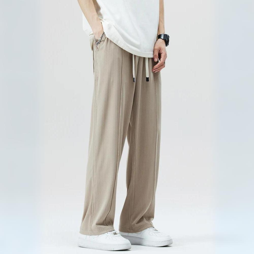 Stylish men's smart casual trousers. Relaxed fit pleated design offers comfort & modern men's fashion.