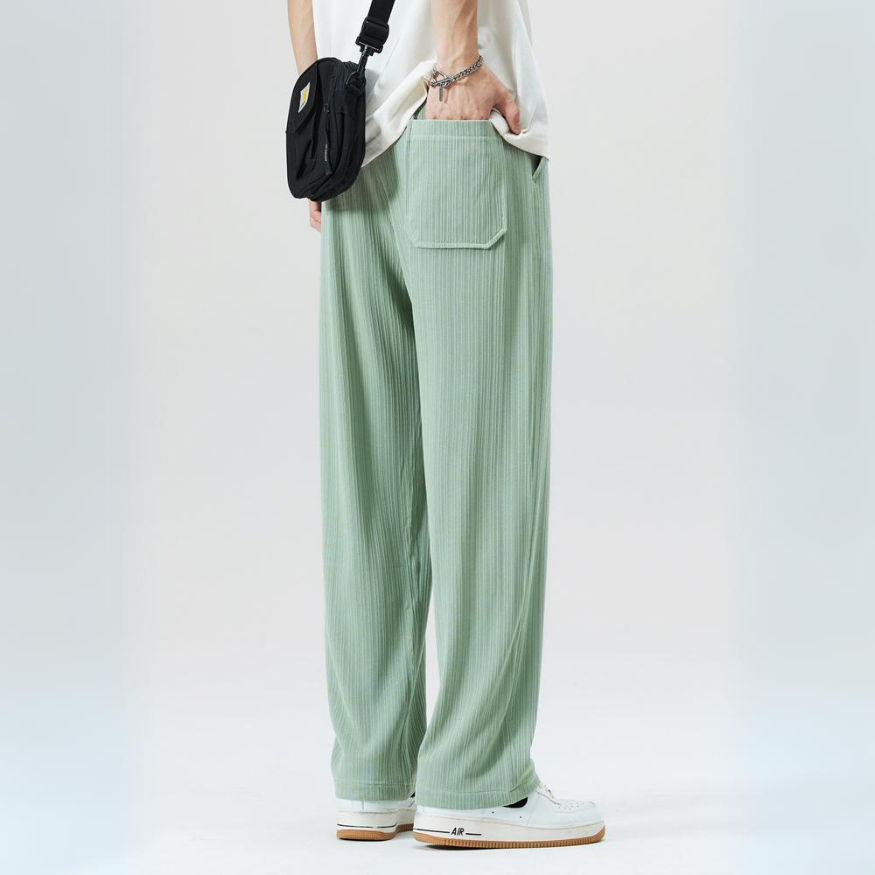 Modern men's relaxed fit pleated trousers in a versatile color. Smart casual bottoms with comfortable waist.