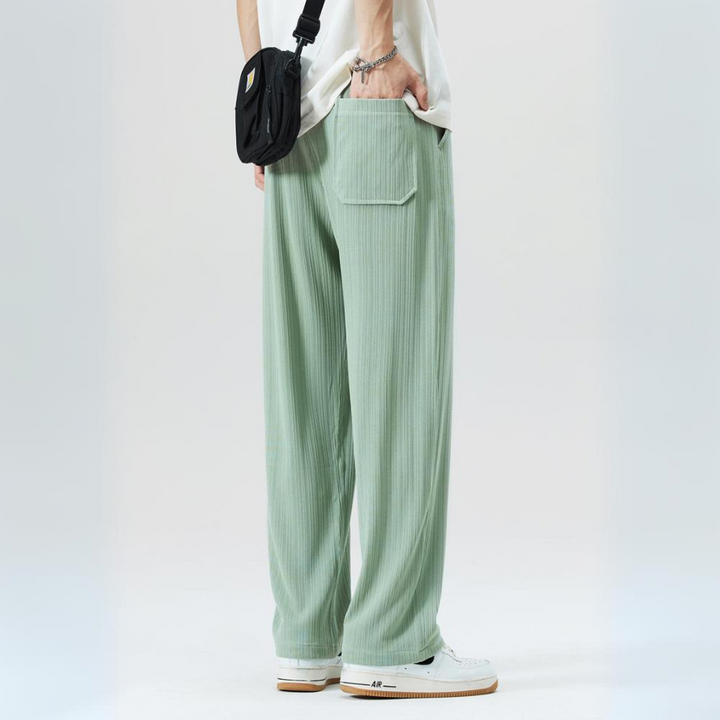 Modern men's relaxed fit pleated trousers in a versatile color. Smart casual bottoms with comfortable waist.