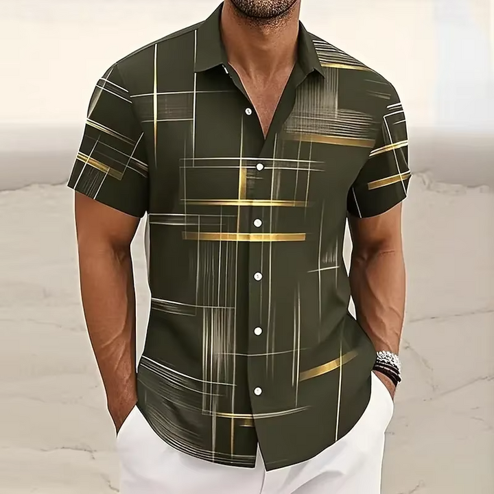 Close-up of a men's short-sleeve polo shirt with vibrant geometric pattern & comfortable relaxed fit.