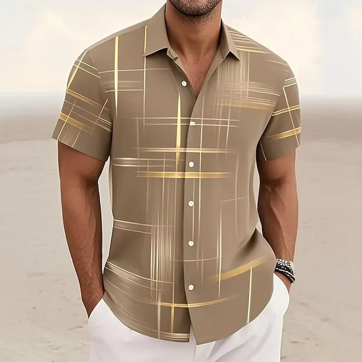 Men's summer fashion polo in a relaxed fit with an eye-catching geometric print and camp collar detail.