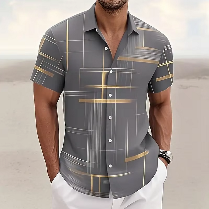 Full shot of a men's modern short-sleeve polo, geometric print, ideal for a relaxed summer style.