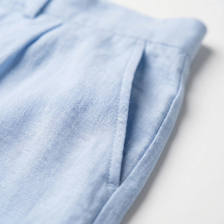 Mid-rise men's pleated relaxed fit trousers, offering effortless straight leg style for smart casual outfits.