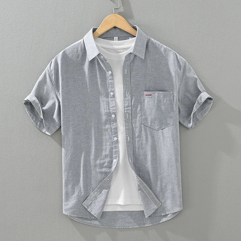 Stylish men's relaxed fit summer shirt. Short sleeve, solid color button-up for versatile casual looks.