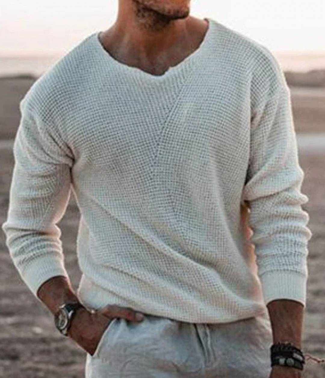 Stylish men's relaxed fit waffle knit v-neck sweater, perfect for comfortable casual layering.