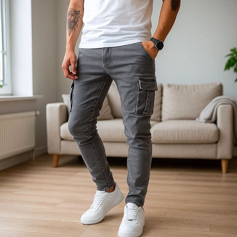 Close-up of practical utility pockets on men's slim fit cargo jeans, showcasing functional design & durability.