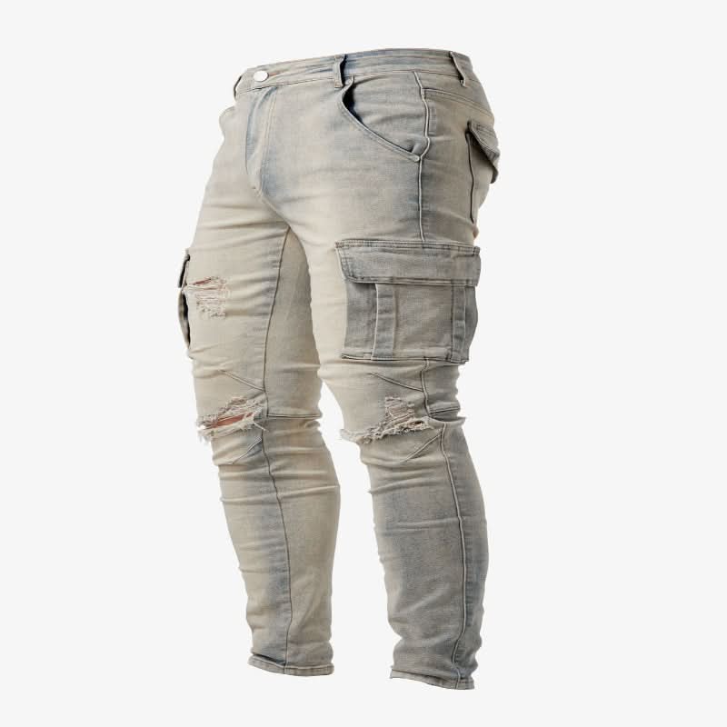 Textured blue denim of slim fit cargo jeans, emphasizing fabric quality, durability, and stylish utility pockets.