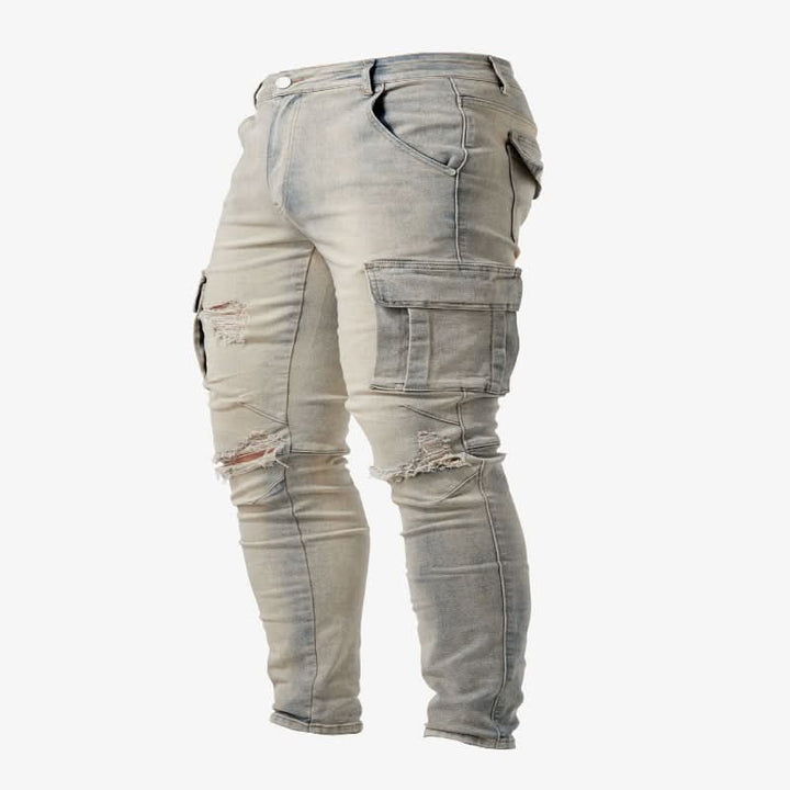 Textured blue denim of slim fit cargo jeans, emphasizing fabric quality, durability, and stylish utility pockets.