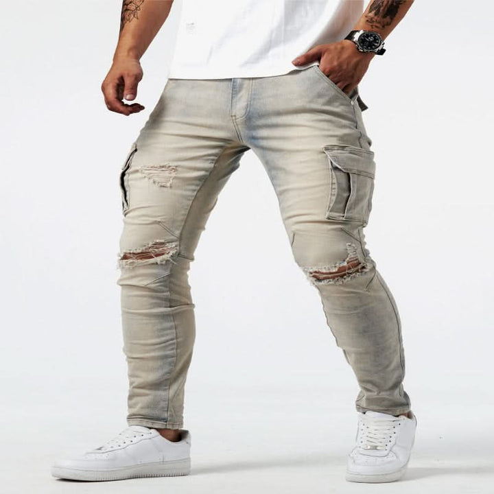 Neatly folded men's blue denim slim fit cargo jeans with visible utility pockets, ready for versatile styling.