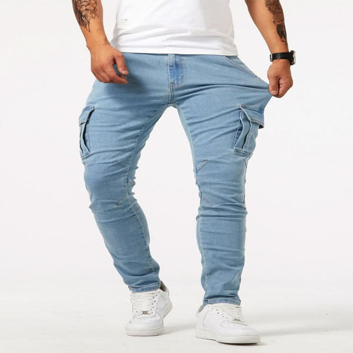 Man walking in comfortable slim fit cargo jeans, showcasing mobility and practical pockets for active casual wear.