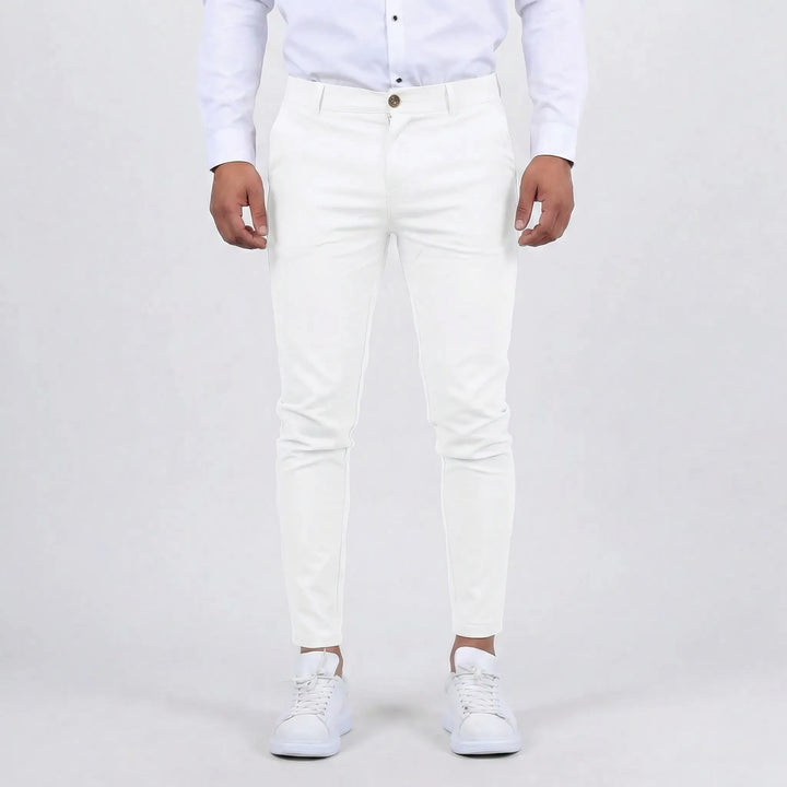 Men's slim fit chino pants styled with a polo shirt, showcasing a relaxed yet stylish everyday outfit.