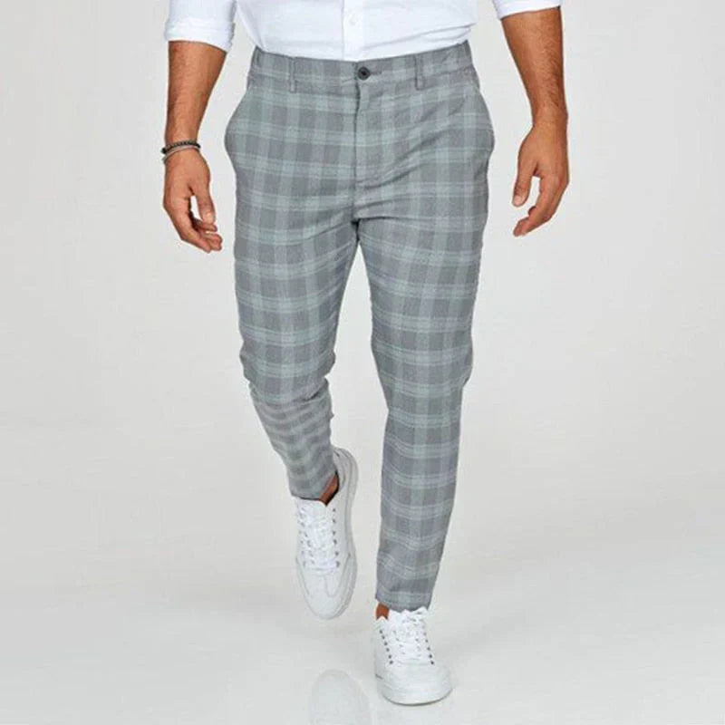 Stylish men's ankle-length checked pants in a slim fit, ideal for contemporary fashion & office.