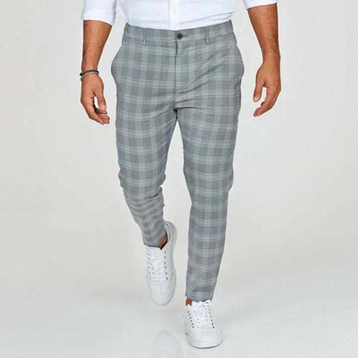 Stylish men's ankle-length checked pants in a slim fit, ideal for contemporary fashion & office.