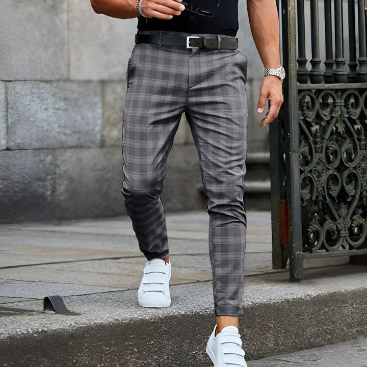 Modern men's checked cropped pants, featuring a slim fit and tapered leg for a sharp look.