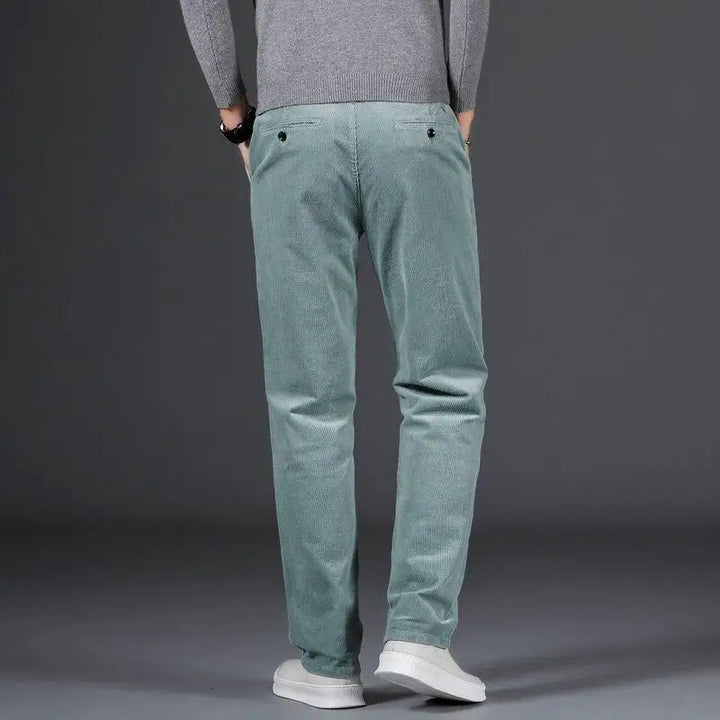 Full shot of men's slim fit everyday comfort pants, showcasing their modern design & versatile apparel style.