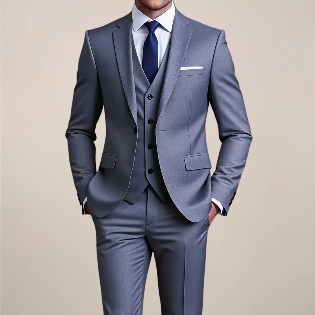 Men's slim fit grey three-piece suit for formal events, business, or weddings. Tailored and sophisticated menswear.