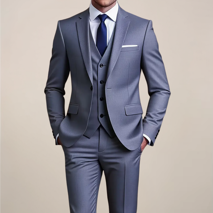 Men's slim fit grey three-piece suit for formal events, business, or weddings. Tailored and sophisticated menswear.