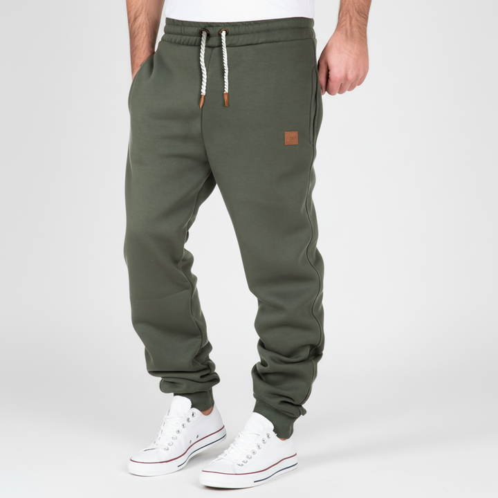 Modern men's slim-fit joggers, combining street style with the comfort of workout pants. Everyday essential.