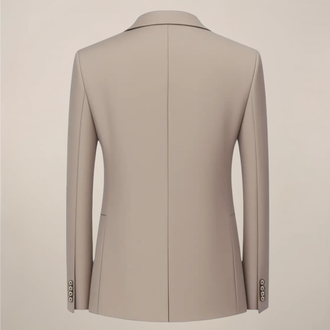 Man wearing a sharp khaki slim fit three-piece suit, styled for a wedding or sophisticated formal event.