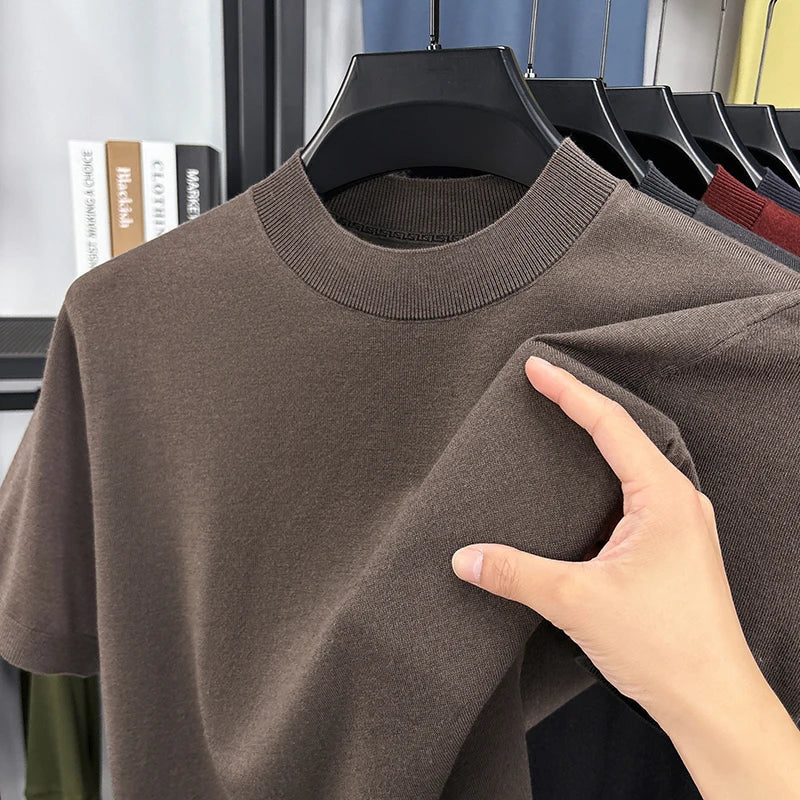 Short sleeve detail of a men's slim fit mock neck t-shirt, casual comfort fit for summer.