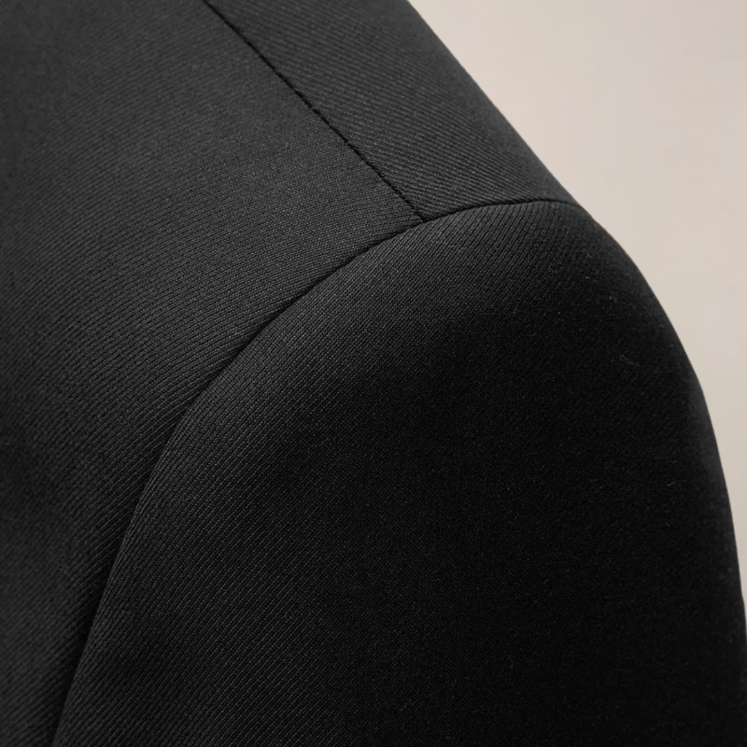 High-quality tailored men's blazer, slim fit for a confident, professional look at formal events.