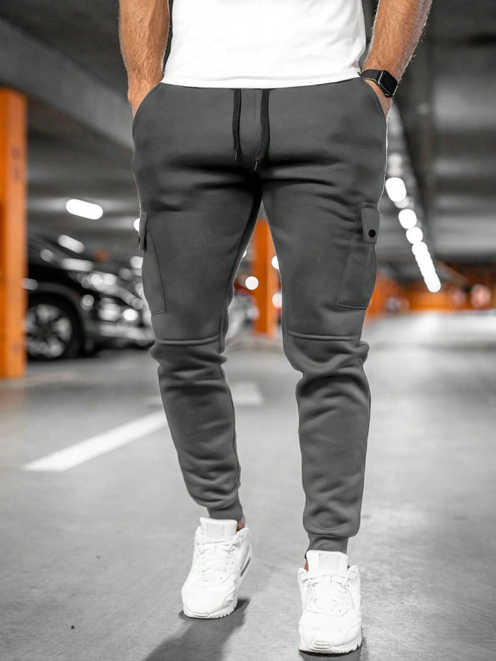 Comfortable men's tapered joggers, sleek slim-fit design for urban streetwear style.