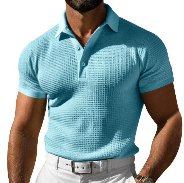 Stylish men's short sleeve polo shirt with textured fabric, ideal for smart casual looks.