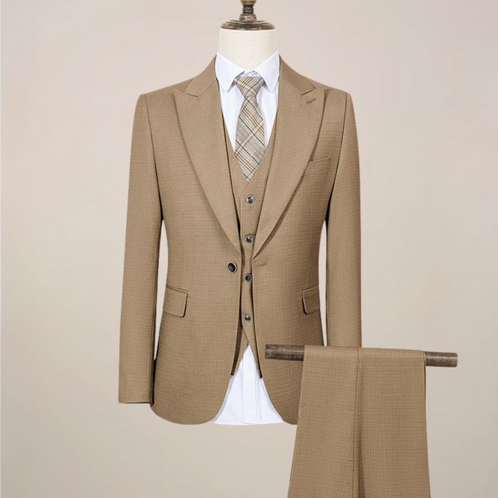 Detail shot of a men's slim fit three-piece suit, showcasing the jacket, vest, and trousers.