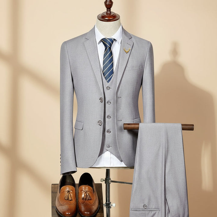 Men's slim fit three-piece suit, perfect for weddings, formal events, and business wear. Tailored, elegant fashion.