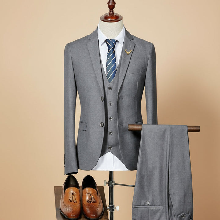 Elegant men's three-piece slim fit suit. Ideal formal wear for weddings, business events, or stylish party attire.